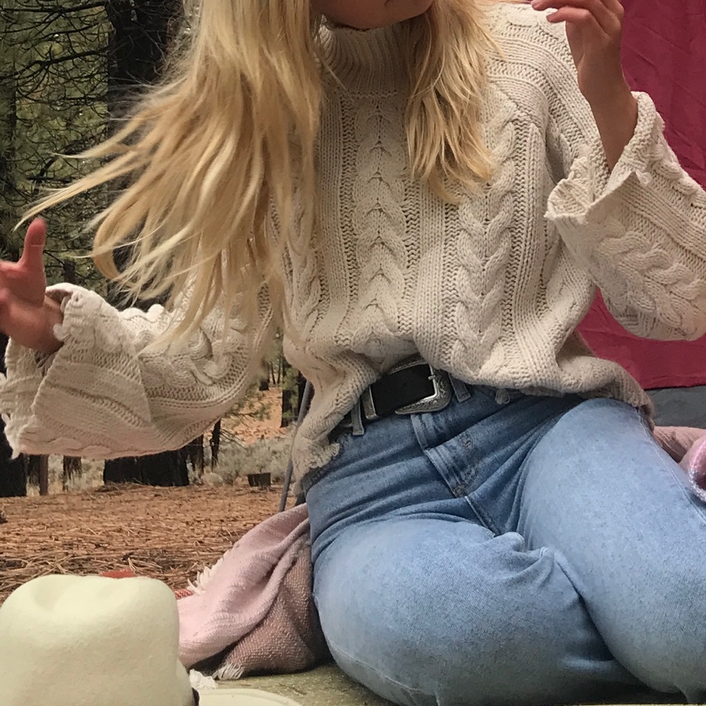 Cream sweater, frayed edges